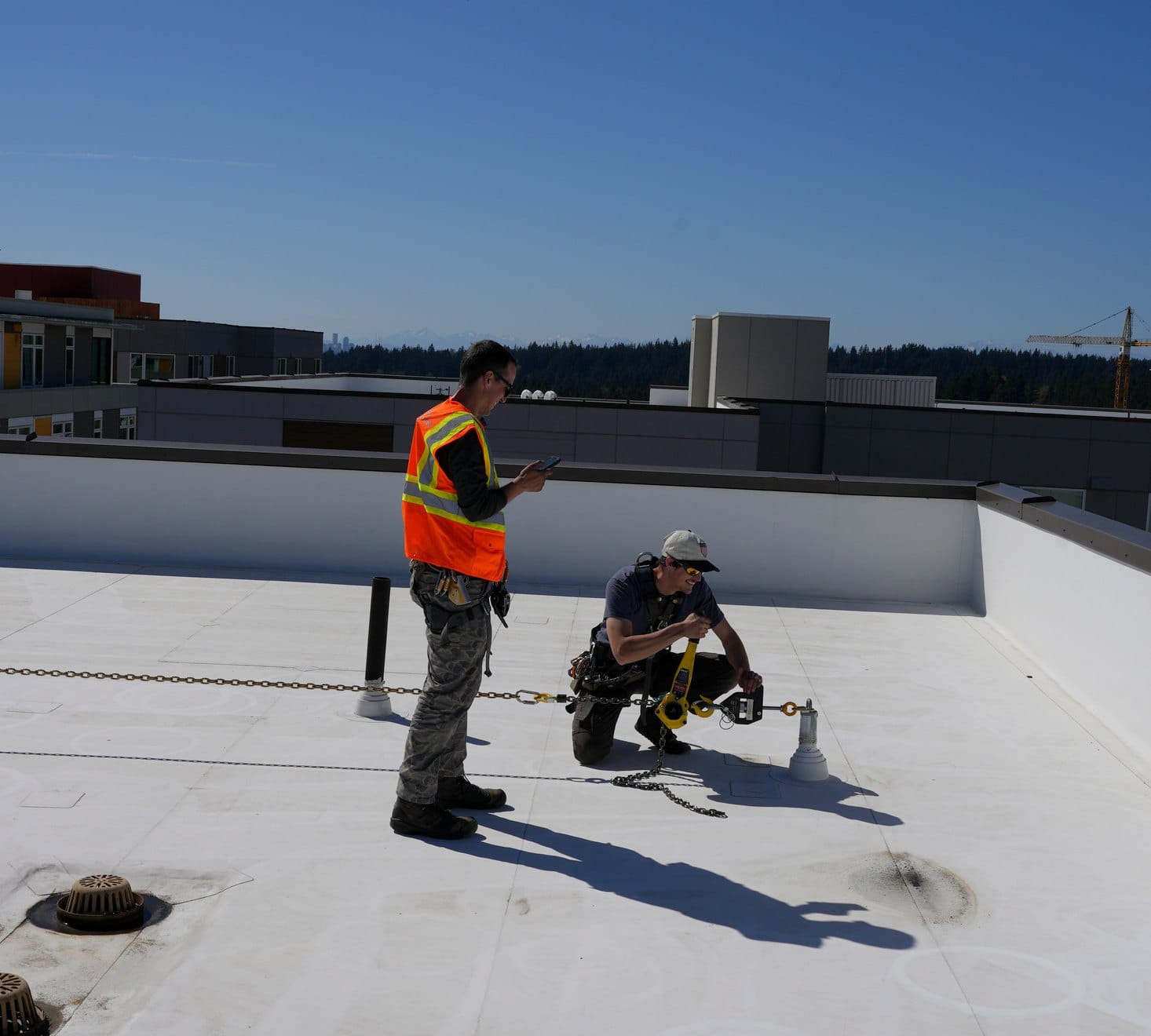 Roof anchors on building rooftop